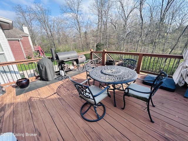 wooden terrace with area for grilling