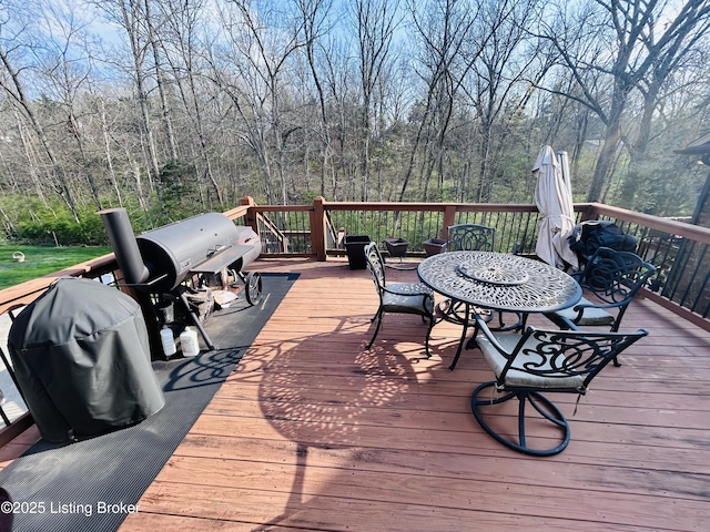 wooden terrace with a wooded view