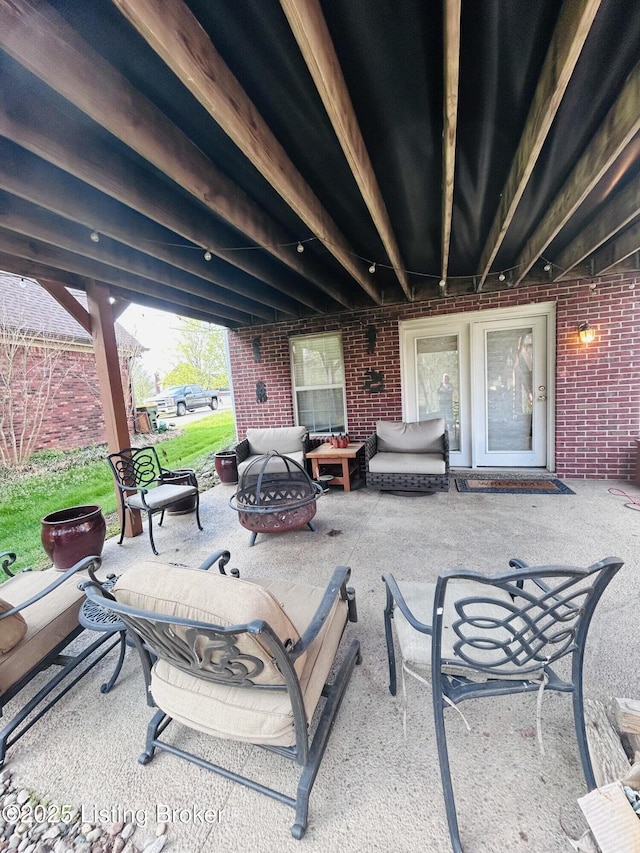 view of patio / terrace featuring an outdoor living space with a fire pit