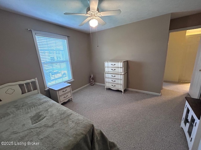 bedroom featuring baseboards, carpet floors, and ceiling fan