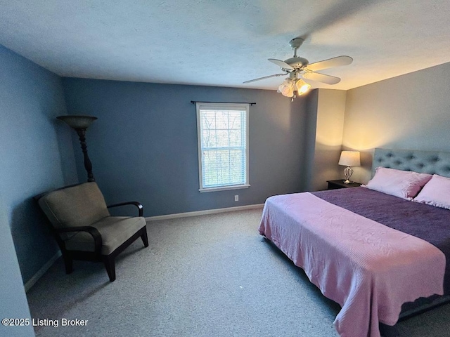 bedroom featuring a ceiling fan, baseboards, and carpet floors