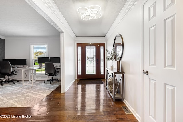 entrance foyer featuring visible vents, baseboards, crown molding, and dark wood finished floors