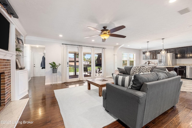 living room with ceiling fan, a fireplace, visible vents, recessed lighting, and dark wood-style floors