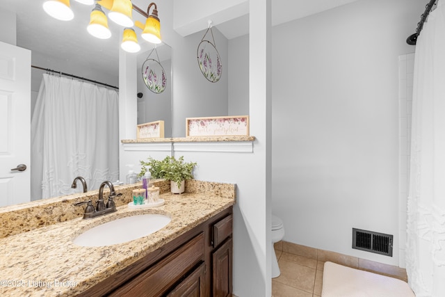 full bath with vanity, baseboards, tile patterned floors, toilet, and visible vents
