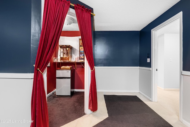 unfurnished bedroom with carpet flooring and baseboards