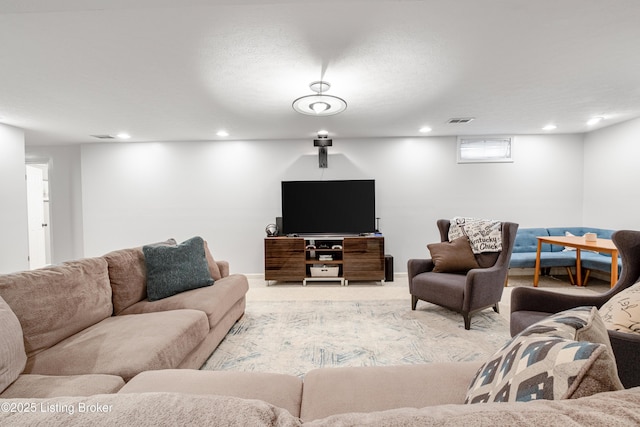 carpeted living room featuring recessed lighting and visible vents