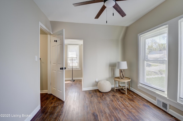 sitting room with plenty of natural light, visible vents, a ceiling fan, and wood finished floors