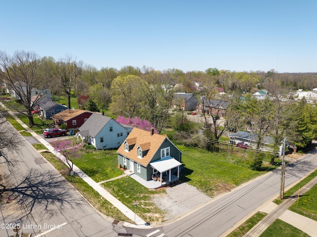 birds eye view of property with a residential view