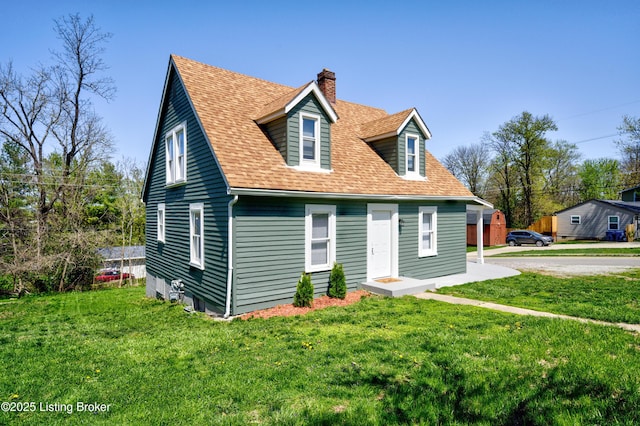 back of property featuring a lawn, a chimney, and a shingled roof