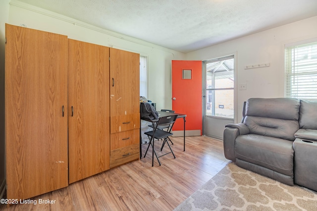 124 E Wellington Ave, Louisville, KY 40214 - interior space featuring a textured ceiling and light wood-type flooring