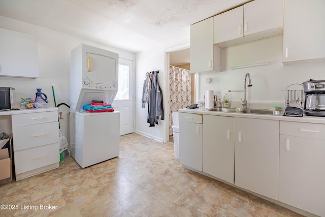 124 E Wellington Ave, Louisville, KY 40214 - interior space featuring a sink, stacked washer / dryer, and laundry area