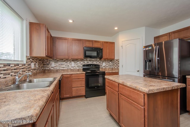 11207 Comfort Ct, Louisville, KY 40229 - kitchen with black appliances, a sink, backsplash, a center island, and recessed lighting