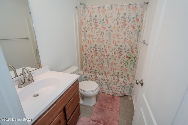 11207 Comfort Ct, Louisville, KY 40229 - bathroom featuring vanity, toilet, and shower / tub combo