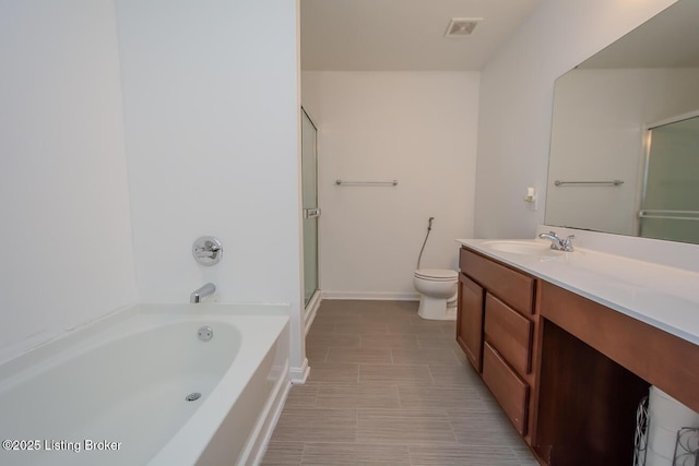 11207 Comfort Ct, Louisville, KY 40229 - full bathroom with vanity, a garden tub, toilet, a shower with shower door, and baseboards