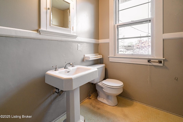 half bath featuring toilet