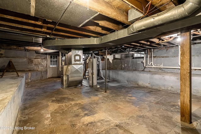 unfinished basement with water heater and heating unit