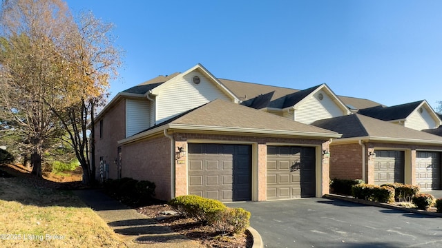 3709 Hurstbourne Ridge Blvd, Louisville, KY 40299 - view of front facade featuring brick siding, driveway, a garage, and roof with shingles