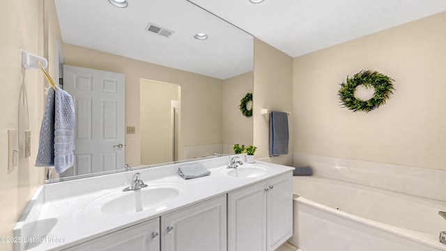 3709 Hurstbourne Ridge Blvd, Louisville, KY 40299 - full bath with a garden tub, double vanity, a sink, and visible vents