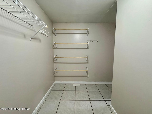 spacious closet with tile patterned flooring