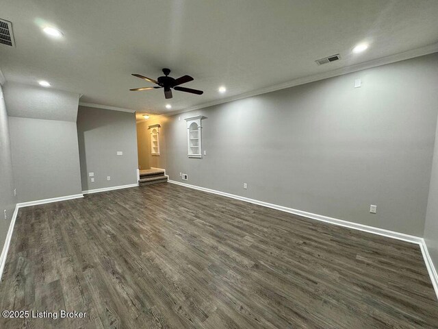 empty room featuring visible vents, baseboards, ornamental molding, and recessed lighting