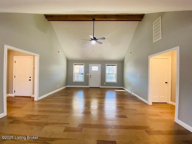 foyer entrance with wood finished floors, beam ceiling, a ceiling fan, and visible vents
