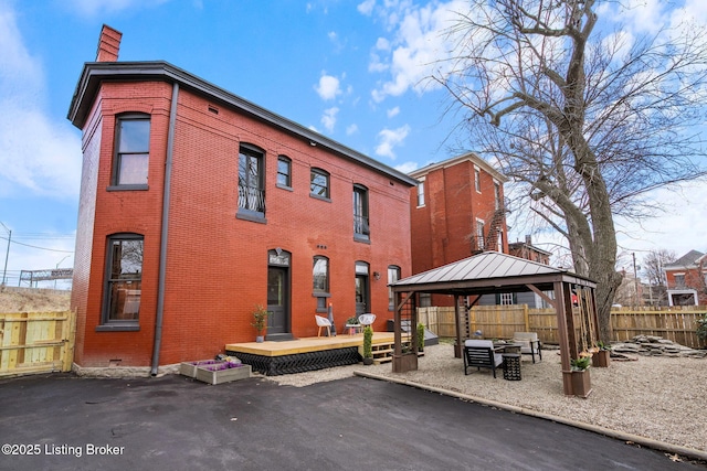 1026 S Brook St, Louisville, KY 40203 - back of house with a patio area, fence, a gazebo, brick siding, and a chimney