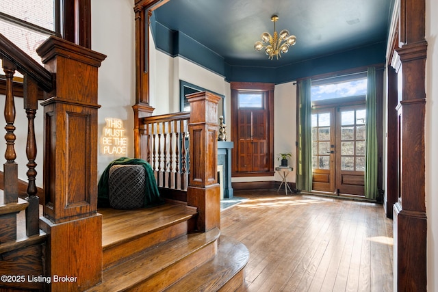 1026 S Brook St, Louisville, KY 40203 - foyer entrance featuring a notable chandelier, hardwood / wood-style flooring, and stairs