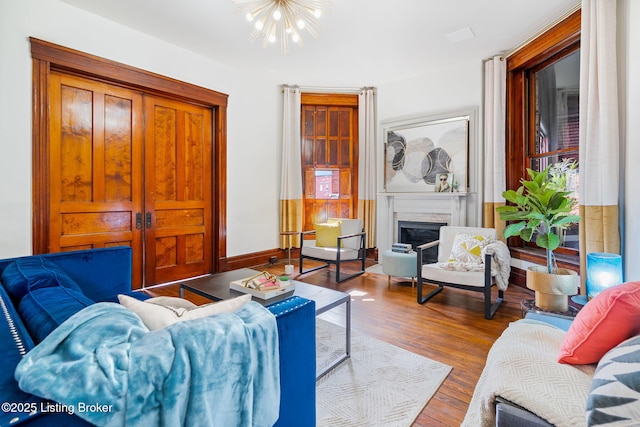 1026 S Brook St, Louisville, KY 40203 - living room featuring a chandelier, wood finished floors, and a premium fireplace