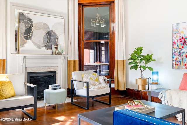 1026 S Brook St, Louisville, KY 40203 - sitting room with an inviting chandelier, wood finished floors, and a fireplace