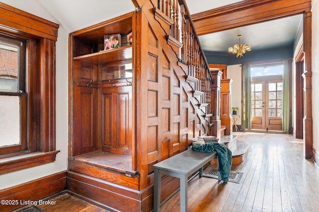 1026 S Brook St, Louisville, KY 40203 - mudroom with a chandelier, hardwood / wood-style flooring, and baseboards