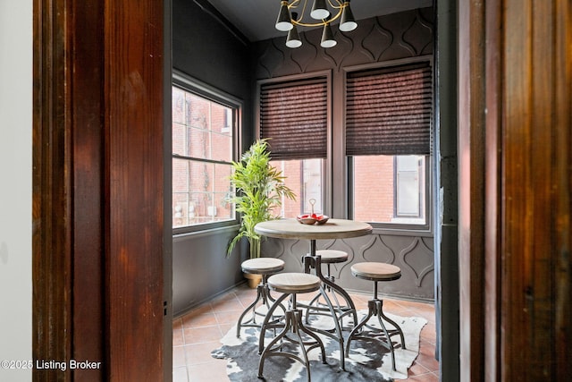 1026 S Brook St, Louisville, KY 40203 - tiled dining area with an inviting chandelier