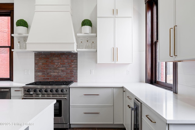 1026 S Brook St, Louisville, KY 40203 - kitchen featuring open shelves, custom exhaust hood, appliances with stainless steel finishes, wine cooler, and backsplash
