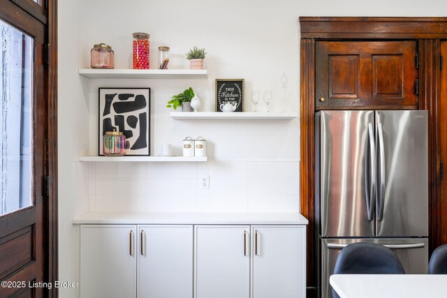 1026 S Brook St, Louisville, KY 40203 - interior details with light countertops, freestanding refrigerator, open shelves, and decorative backsplash