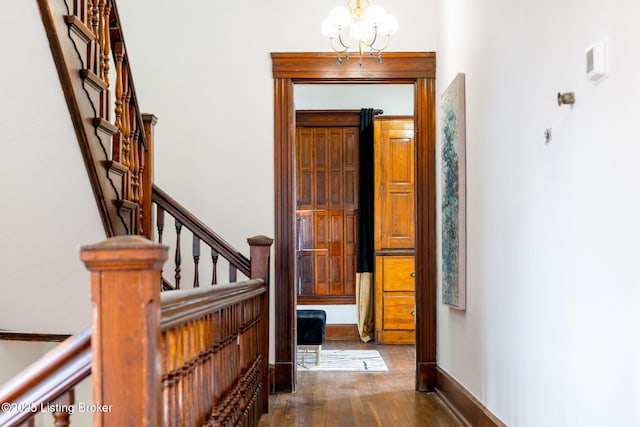 1026 S Brook St, Louisville, KY 40203 - entryway with a chandelier, wood finished floors, baseboards, and stairs