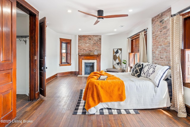 1026 S Brook St, Louisville, KY 40203 - bedroom featuring wood-type flooring, baseboards, recessed lighting, and a fireplace