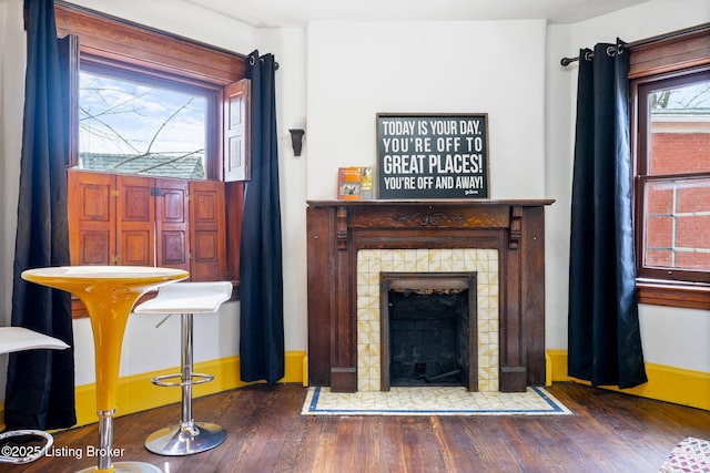 1026 S Brook St, Louisville, KY 40203 - living area with a tiled fireplace and wood finished floors
