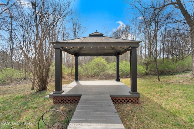 exterior space featuring a gazebo and a wooden deck