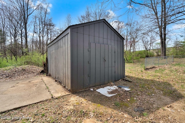 view of shed with fence