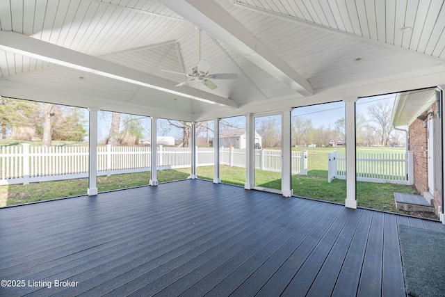 unfurnished sunroom with ceiling fan and beam ceiling