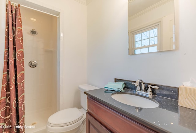 full bathroom with toilet, a stall shower, vanity, and crown molding
