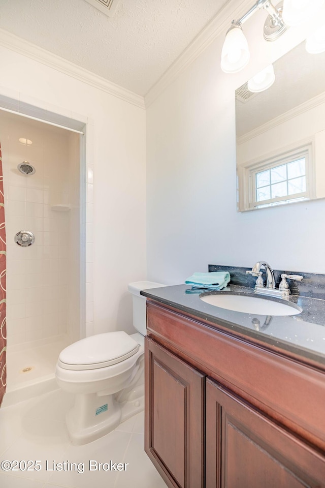 full bath with vanity, a stall shower, a textured ceiling, crown molding, and toilet
