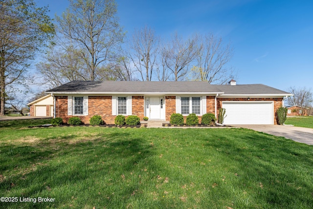 single story home with a front yard, brick siding, an attached garage, a chimney, and concrete driveway