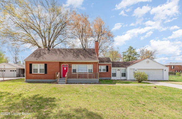 view of front of home featuring a chimney, driveway, a front lawn, brick siding, and a garage