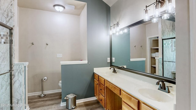 5214 Charlbury Ct, Louisville, KY 40241 - bathroom with toilet, wood finished floors, a sink, and baseboards