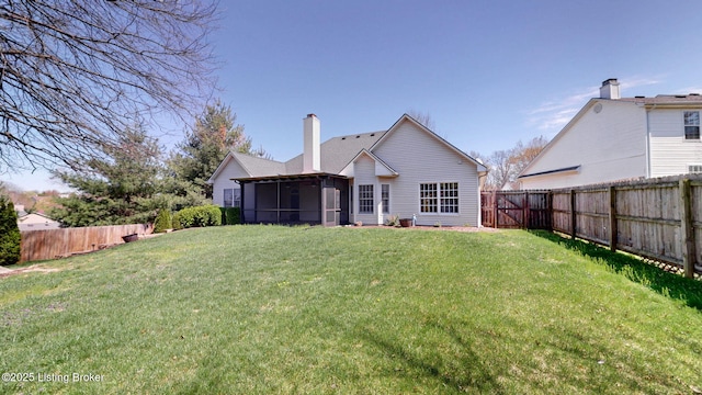 5214 Charlbury Ct, Louisville, KY 40241 - back of house with a yard, a fenced backyard, a sunroom, and a chimney