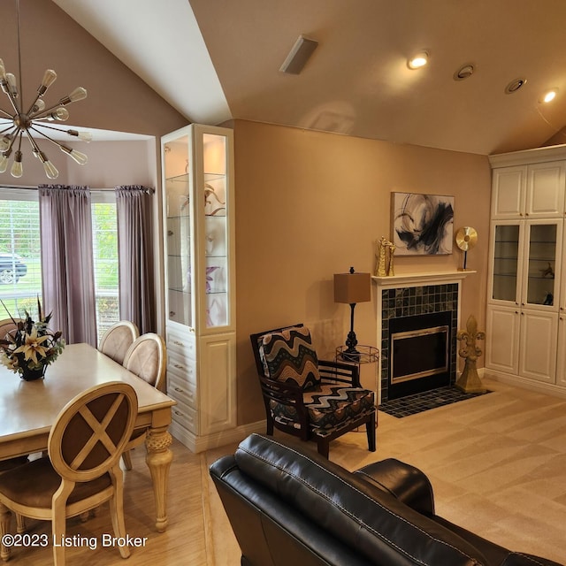 404 Eastgate Village Wynde, Louisville, KY 40223 - living room with recessed lighting, an inviting chandelier, a tile fireplace, and lofted ceiling