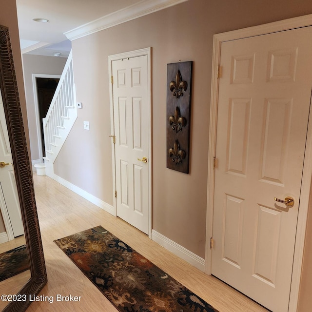 404 Eastgate Village Wynde, Louisville, KY 40223 - corridor with crown molding, baseboards, light wood-type flooring, and stairs