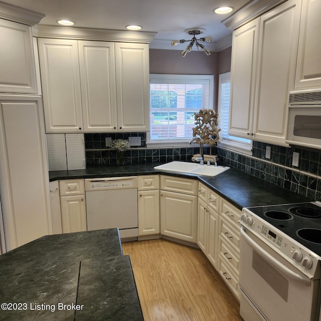 404 Eastgate Village Wynde, Louisville, KY 40223 - kitchen with white appliances, light wood-type flooring, white cabinetry, a sink, and decorative backsplash