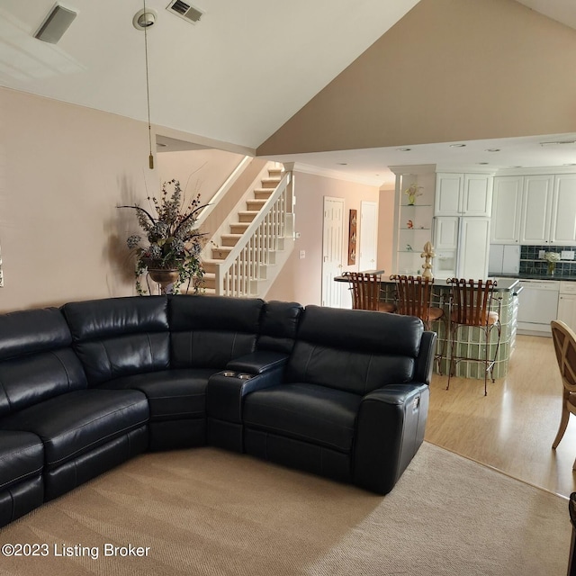 404 Eastgate Village Wynde, Louisville, KY 40223 - living area featuring light wood-style flooring, crown molding, stairs, visible vents, and high vaulted ceiling