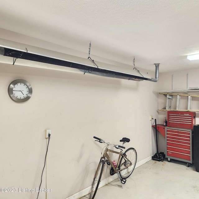 404 Eastgate Village Wynde, Louisville, KY 40223 - garage featuring baseboards